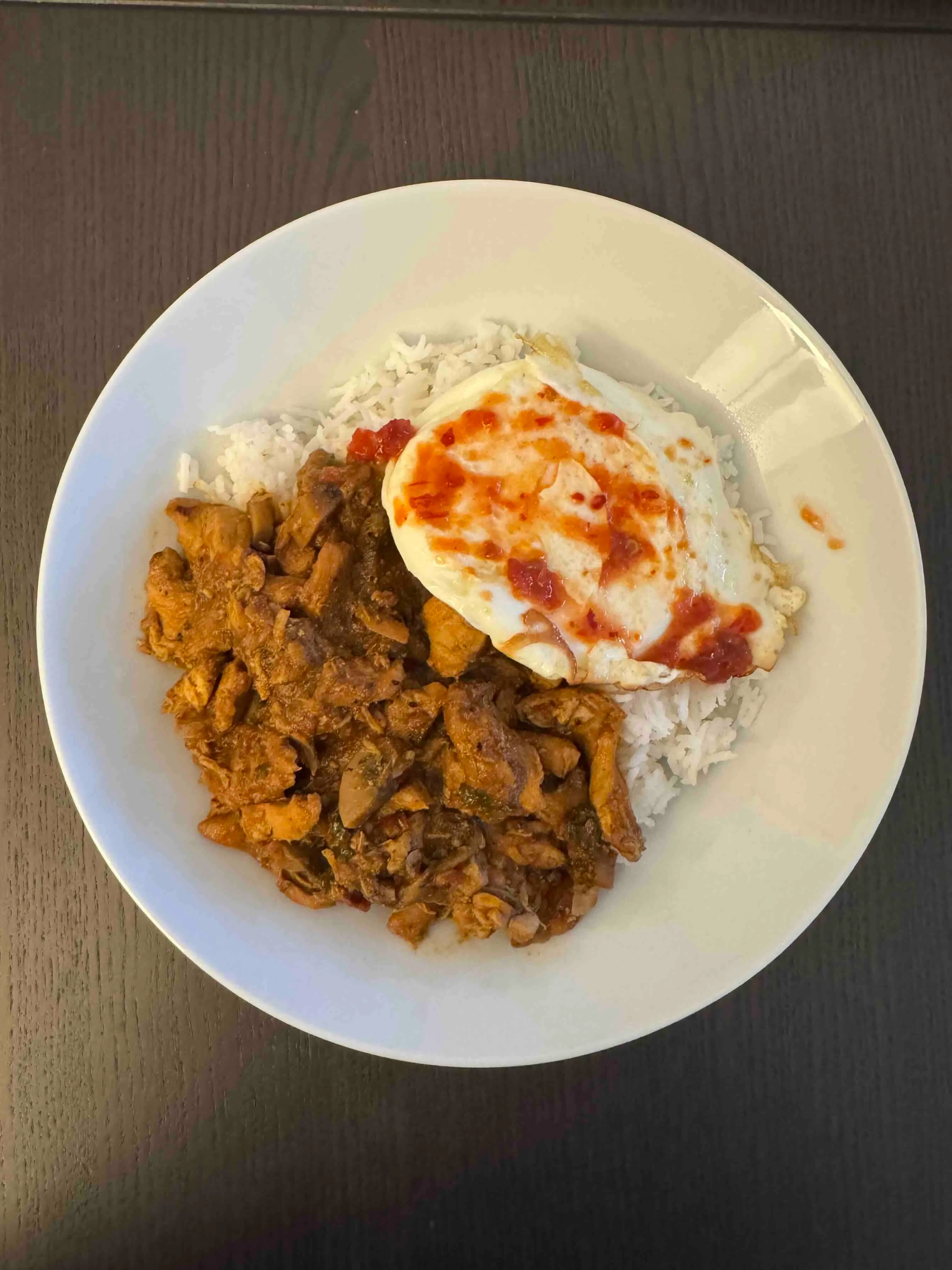 An uninspiring chicken, rice, and egg bowl